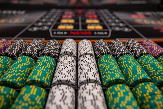 The Ultimate Guide to Bankroll Management Close-up of colorful casino chips arranged on a gaming table, ready for play.